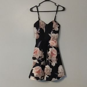 A'gaci mini cocktail dress, black with floral pattern size 6